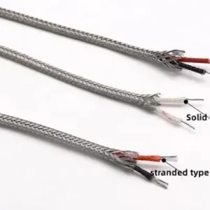 Thermocouple compensation cable stripped end showing matched alloy conductor pair with IEC colour coded insulation