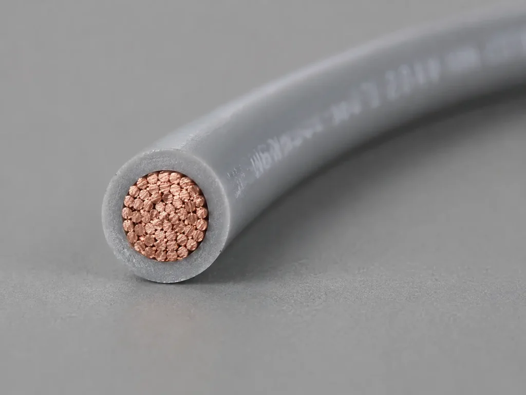Macro cross-section of UL 1007 22 AWG PVC wire showing conductor and thin extruded PVC wall