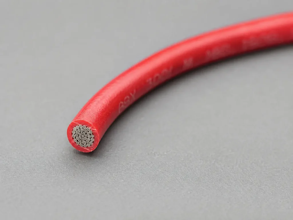 Macro cross-section of UL 1007 28 AWG PVC wire showing fine stranded conductor and thin extruded PVC wall