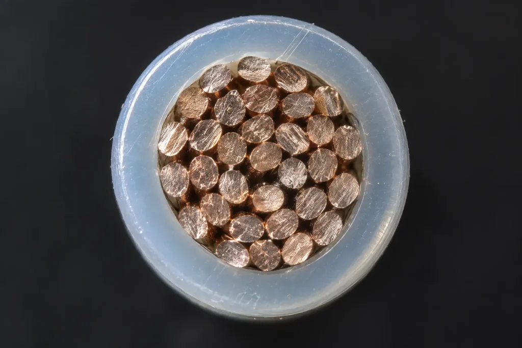 Macro cross-section of UL 10362 wire showing the extruded PFA insulation wall over the conductor