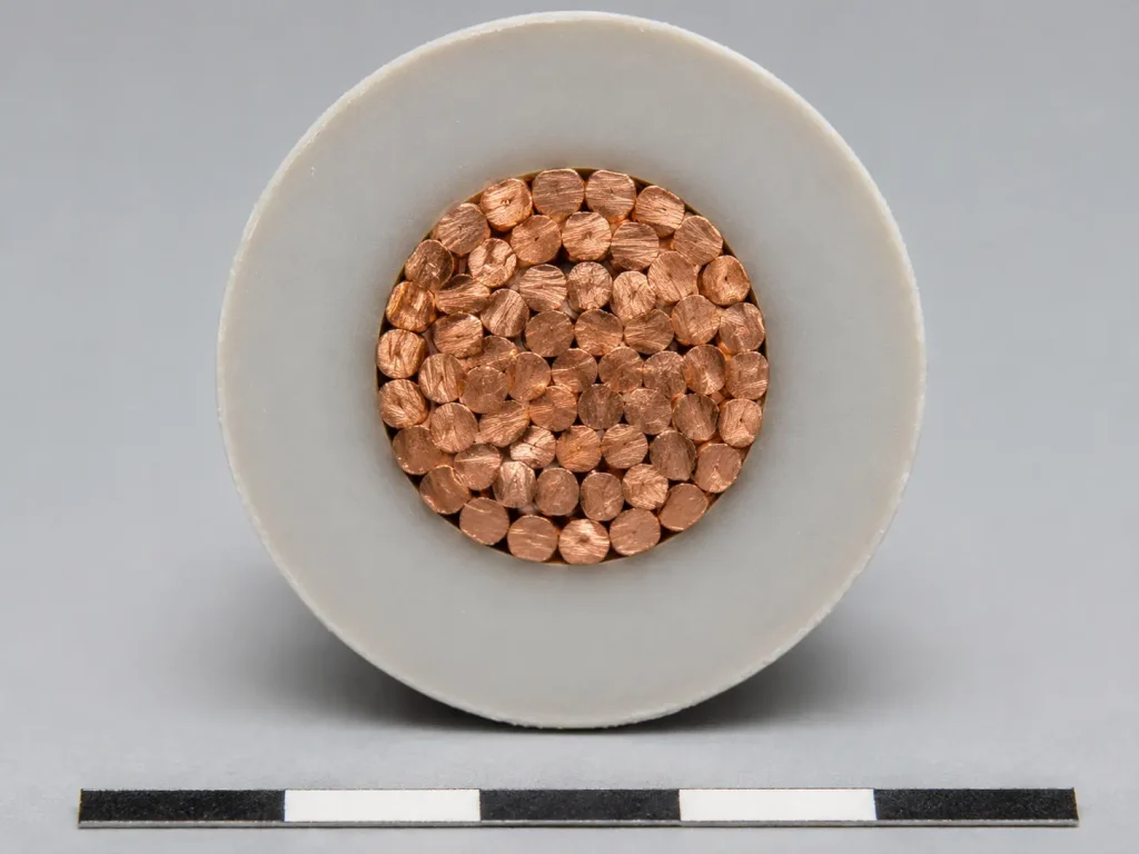 UL AWM 3239 high-voltage DC wire cut-end close-up showing stranded conductor and construction-dependent insulation wall, thermoplastic or thermosetting per UL Subject 758