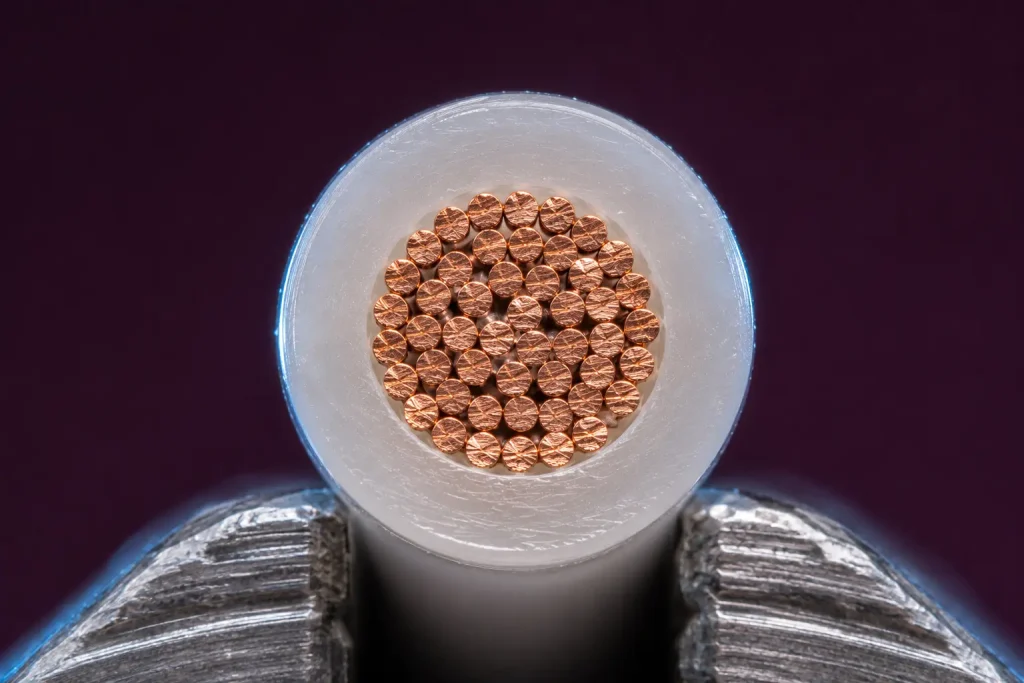 Macro cut end of UL 1330 20 AWG showing seamless FEP insulation 20 mil wall and stranded copper conductor